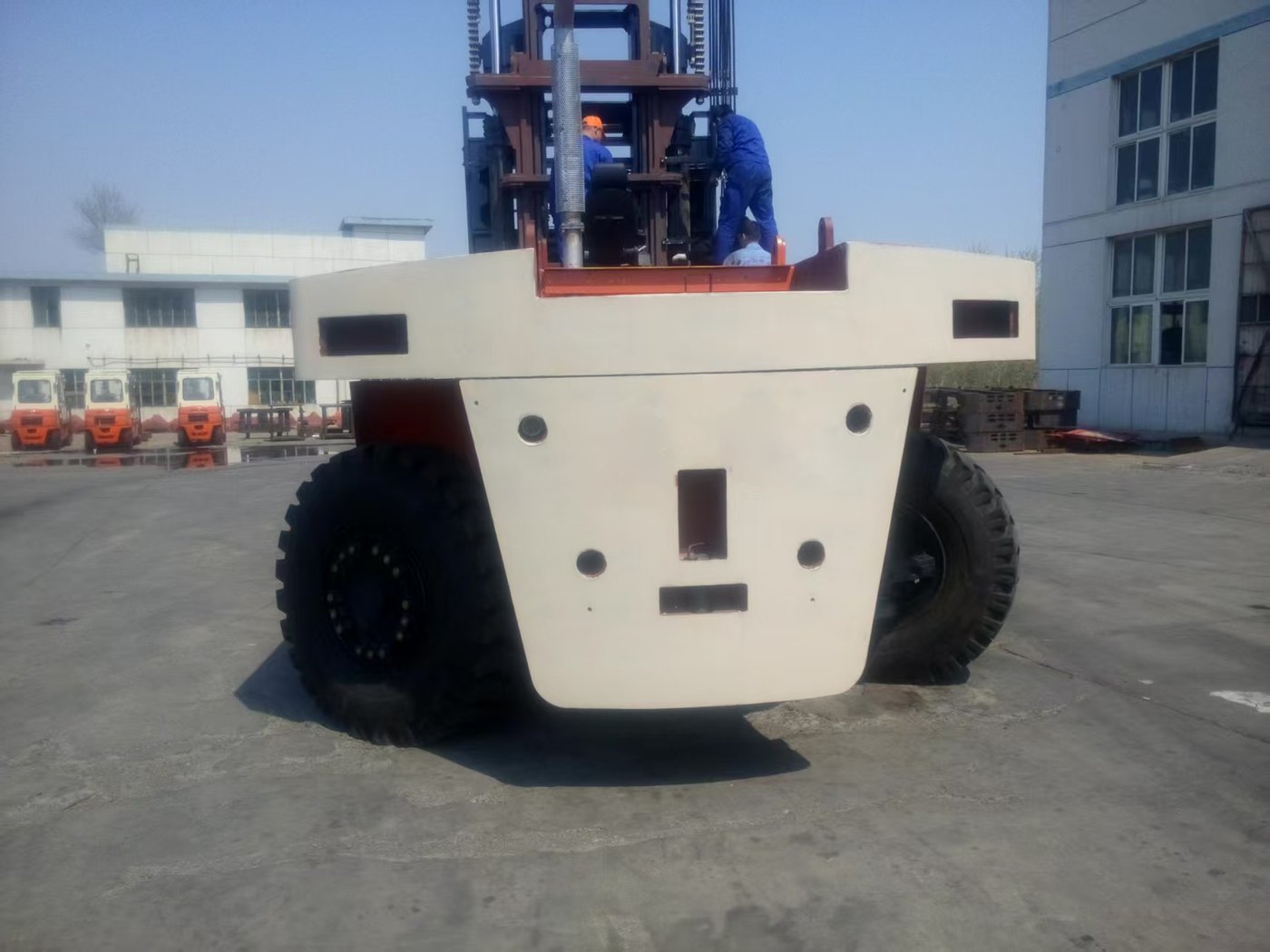 Welded composite counterweight fitted to a container handler
