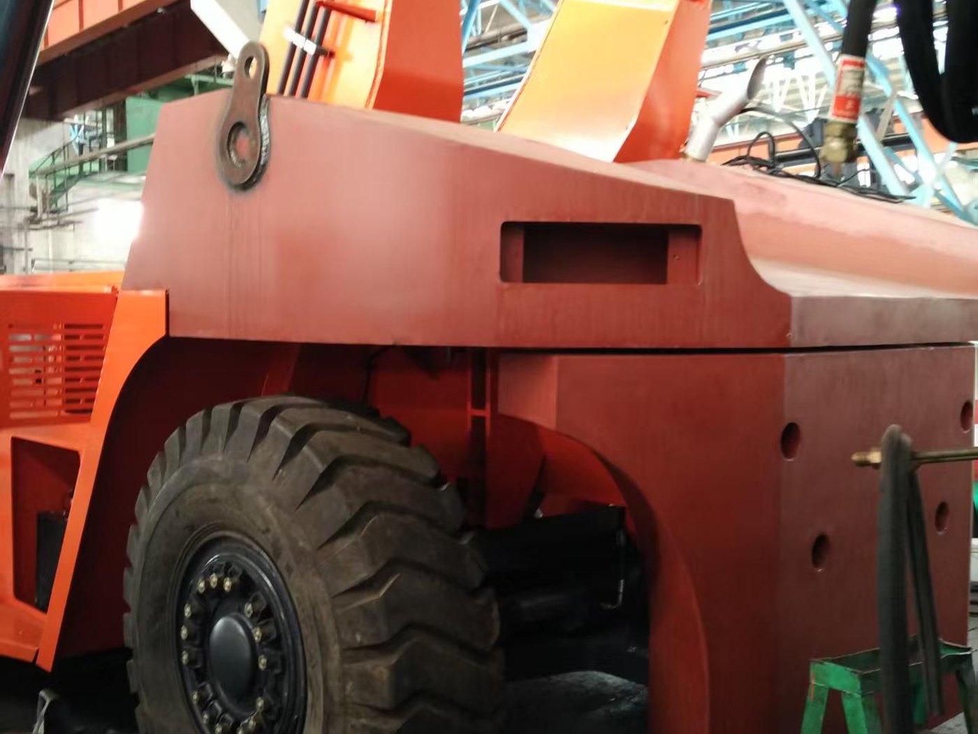 Welded composite counterweight for a reach stacker
